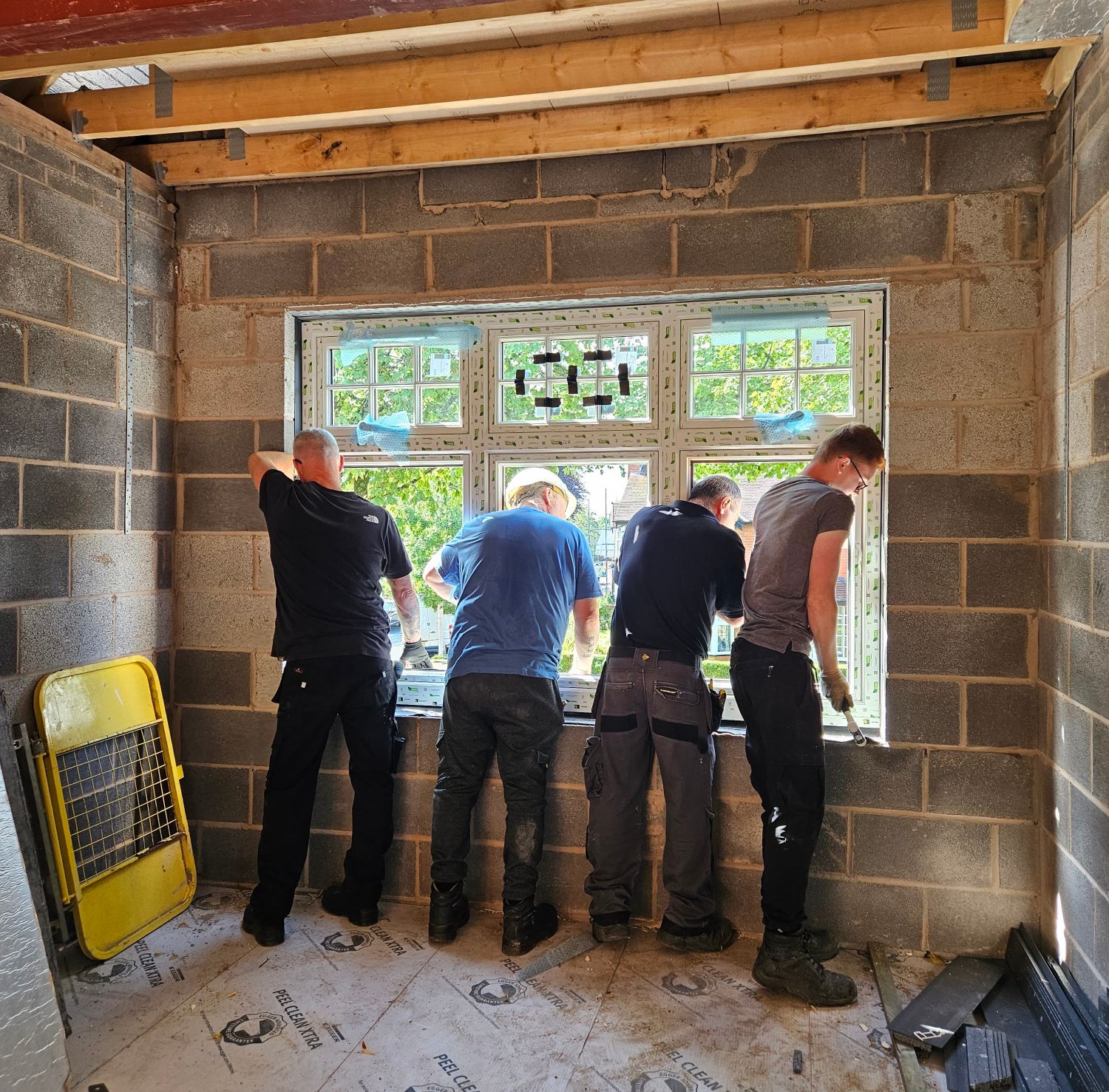 Hamlet Sookasian tiling a bathroom